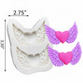 A white silicone mold with angel wing and heart designs, shown next to two small winged heart decorations in purple and pink, on a plain white background.